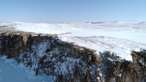 Aerial Over the Rocky Cliff at Lake Baikal Winter Landscape of Frozen Baikal Popular Tourist Spot