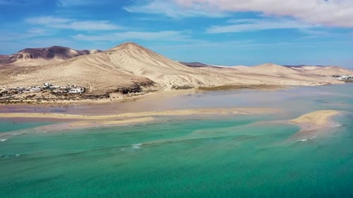 View on the beach Sotavento with golden sand and crystal sea water of amazing colors on Costa Calma