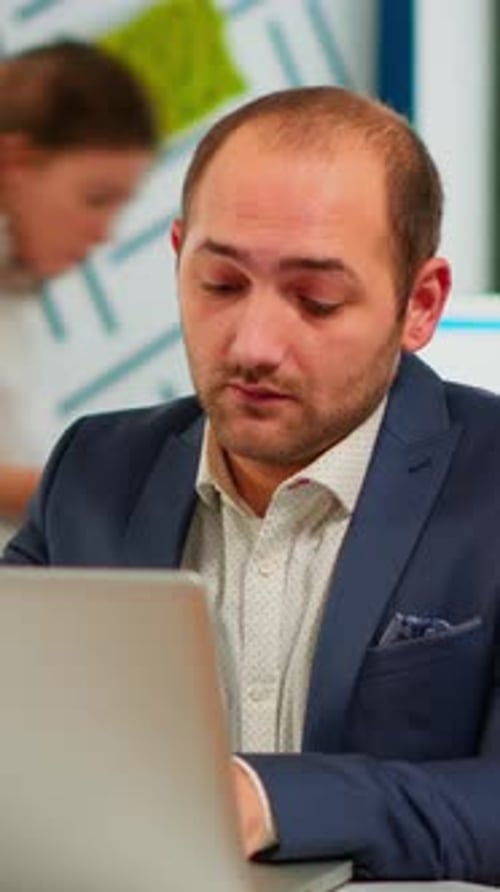 Man Working on Computer in Office Setting