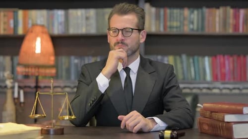 Portrait of Male Lawyer Brainstorming while in Office