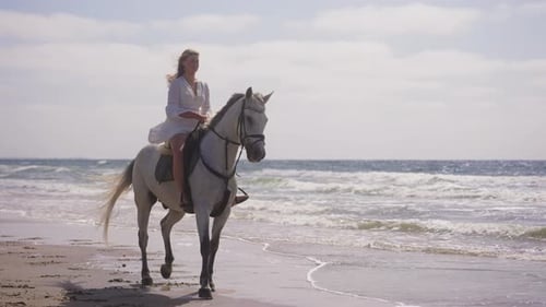 A Girl Horse Riding By The Beach