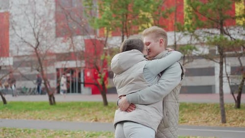 Loving Couple Embracing in Urban Autumn Setting