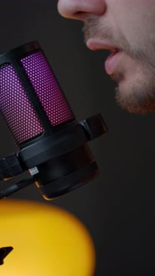 Man Speaking Into Studio Microphone Close Up