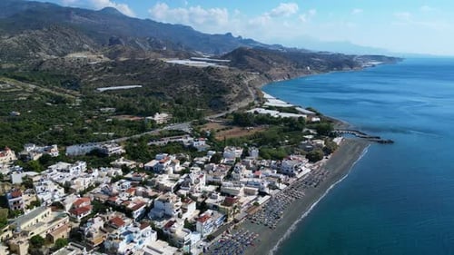 Drone aerial of Beach In Crete, Greece at city Mirtos