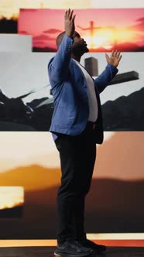 Vertical Video Black Spiritual Adult Meditating on Faith and Serenity in a Pose of Worship