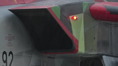 Airplane Body Close Up with Raindrops and Ladder