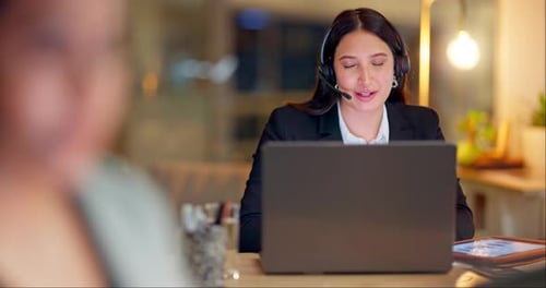 Call center, laptop and woman at night in office for customer service, CRM advisory