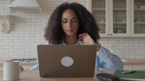Black African Woman Carefree Typing Text on Laptop Stretching Relaxing
