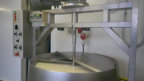 Milk being pasteurized in a clean sterilized processing