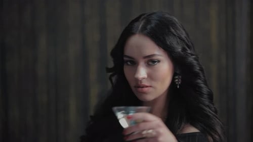 Elegant Young Adult Woman Holding Martini