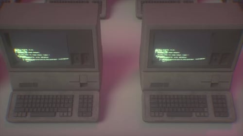 Endless Row of Retro Computers With Scrolling Code in Neon Light