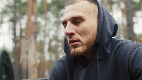 Young Athlete Boxer Man Rests After Workout in the Forest Portrait of Young Man After Training