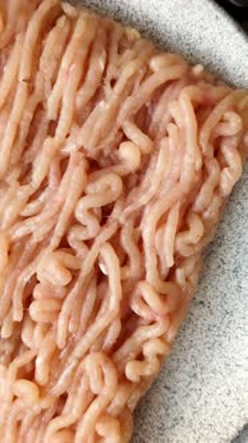 Raw fresh ground chicken, turkey, or pork for burgers or meatballs. Raw ground chicken