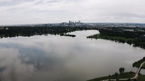 Drone shot of Sloan Lake sitting in Denver's outer suburban neighborhood.