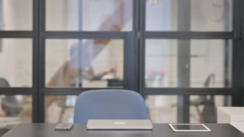 Adult Businessman Arrives at Modern Office Desk