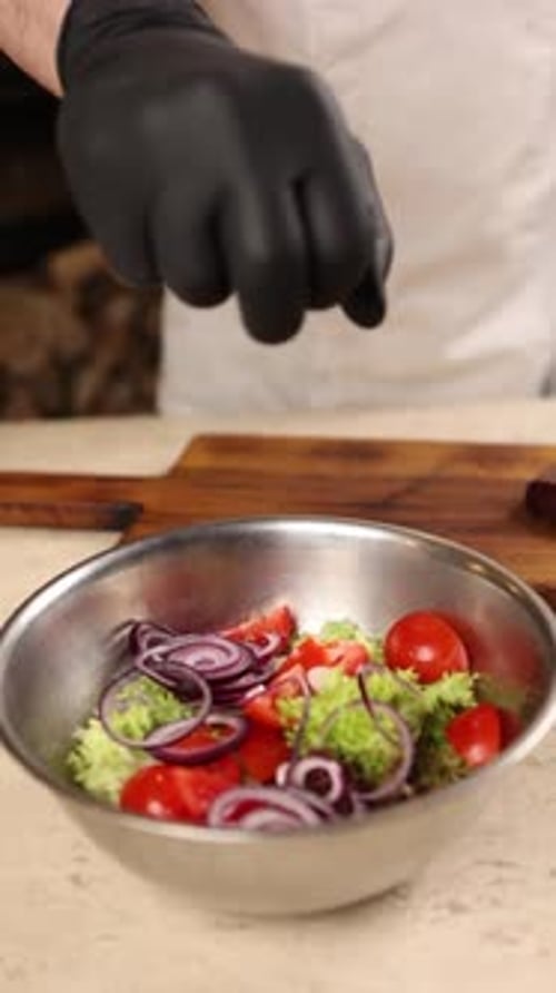 Chef prepares a delicious salad in a restaurant