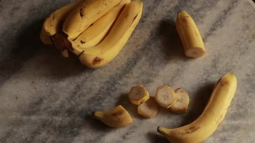 Sliced fresh banana on a table. Slow motion rotation. Close up