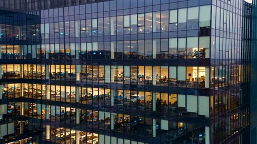 Aerial View of Skyscraper Facade and Corporate Offices at Night