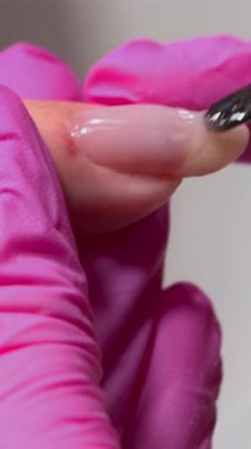 Closeup Of Manicure Process Involving Gel Application And Precise Surface Smoothing For Glossy