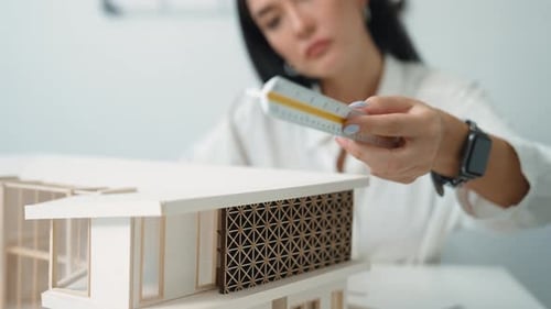Architectural Designer Working on a Home Model