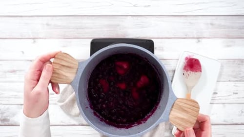 Step By Step Preparing Mixed Berry Compote From Frozen Berries in a Nonstick Cooking Pot