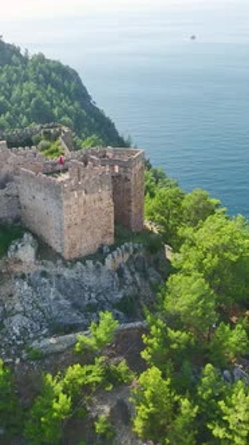 Vertical Video Ancient Heights Guy's Summer Journey to Alanya's Seaside Fortress