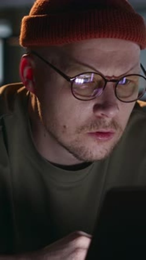 Man Frustrated at Laptop After Finding Major Mistakes in Work
