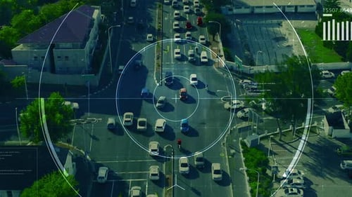 4k video footage of a camera zooming in to vehicles driving along urban roads during the day