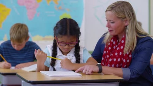 Teacher and Student in School Classroom Asian