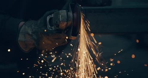 Worker Using Industrial Grinder Metalwork Industry