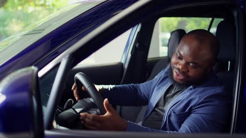 Man Doing Test Drive Examining Car Before Making Purchase