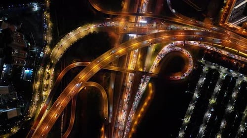 Overhead view of intricacies of vehicles stuck in nighttime traffic jam