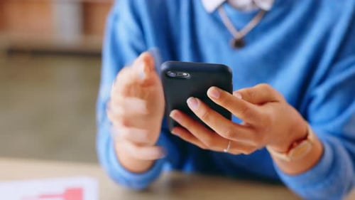 Close Up of Hands Holding Cell Phone
