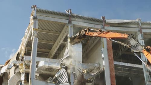 Excavator with Knife Cuts Support of Dangerous Stadium