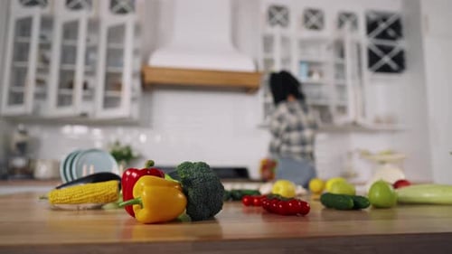 Woman Prepares Food in Bright Kitchen