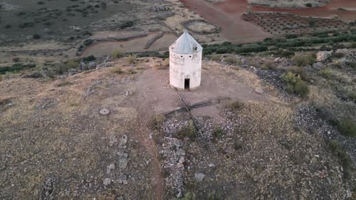 Old white windmill on top of the hill. Aerial 4k footage