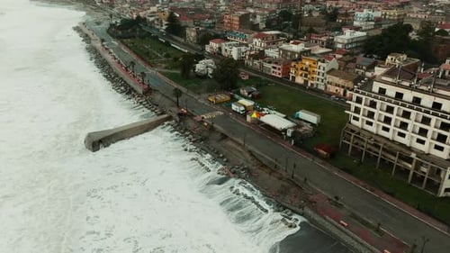 Ocean Waves Destroy Buildings and Road During Storm Surge Climate Change