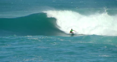 Man Surfing Large Wave In Crystal Blue Ocean, Slow Motion