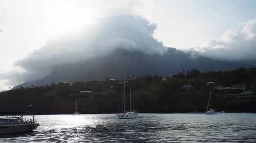 Breathtaking Coastal Landscape With Mist And Sailboats
