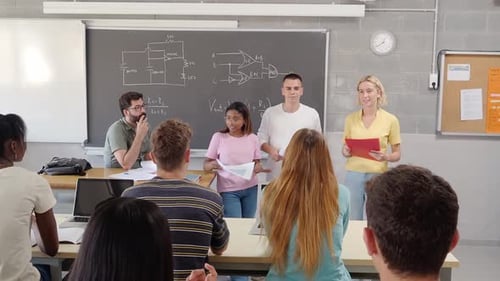 Group of Teenage Students Present a Teamwork in Class