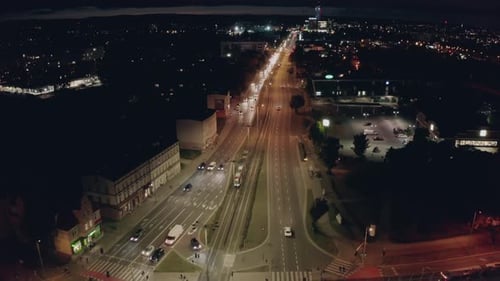 Top Down View of an Intersection with Car Traffic at Night