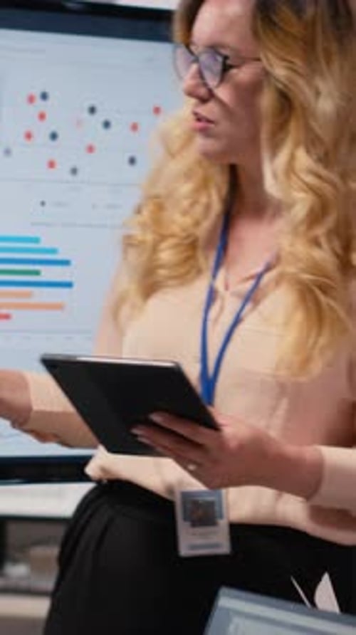 Vertical Video Ambitious CEO Presenting Performance Indicators to Her Staff in a Boardroom
