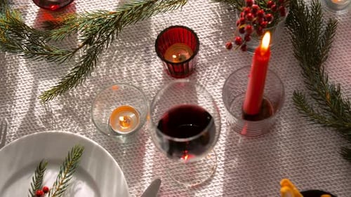 Festive Table Setting with Wine and Candles
