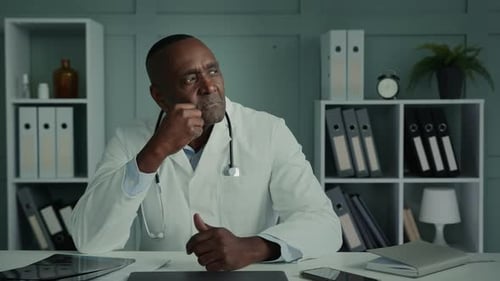 Thoughtful Doctor in Office Contemplating Diagnosis