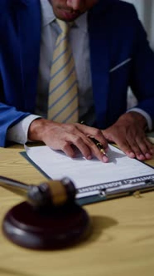 Attorney Signing Contract Agreement with Gavel