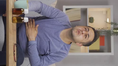 Vertical video of Man experiencing stomachache.