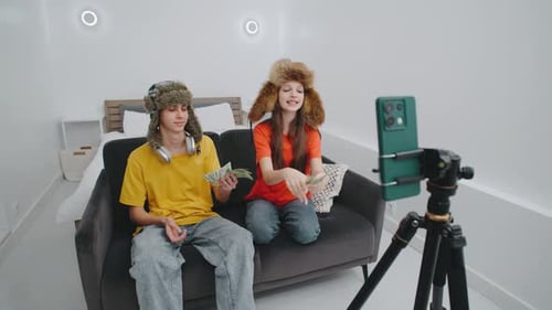 Teens Record Video and Count Cash in Room