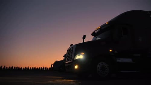 Semi Trucks Parked at Dusk