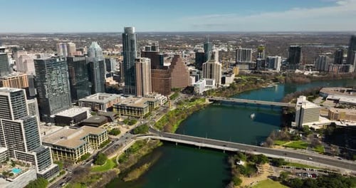 Aerial shot of downtown Austin, TX with the Colorado River in frame