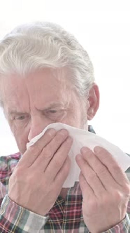 Portrait of Sick Casual Old Man Sneezing, vertical video